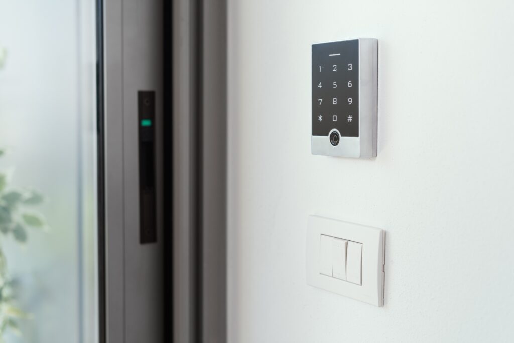 Man setting an alarm code for home security